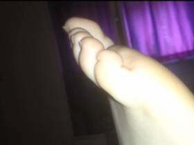 Boredom in bed (She is barefoot)