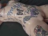 Tattoo model fisted on the mattress