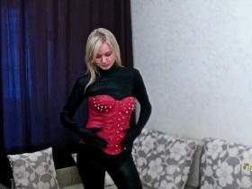 Christina posing in Spandex Catsuit , Stiefel und Korsage