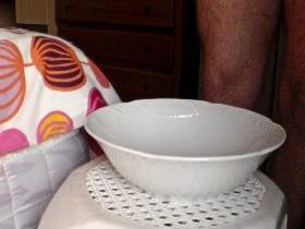 John is Peeing into a Porcelain Bowl
