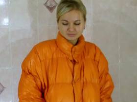Christina takes a shower in orange Moncler down jacket