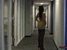 In Amsterdam, in the hotel corridor, I show myself naked, in high heels, stockings & a plug in my ass.