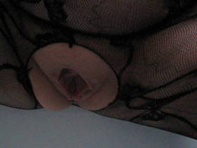 In Catsuit pissing in the bath