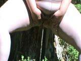 pissing in pantyhose in the woods