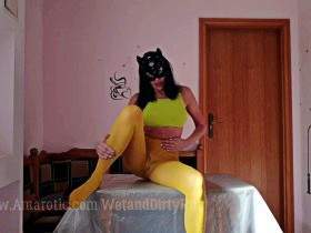 On the table in wet yellow nylon tights