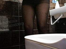 Olga with anal beads in the toilet