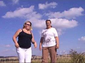 Two lesbians strip and sun on the meadow