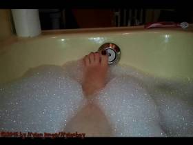 A woman's sexy feet in the tub