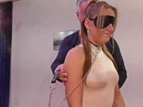 On a leash and blindfolded