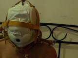 Slut is tied up in mask on the bed