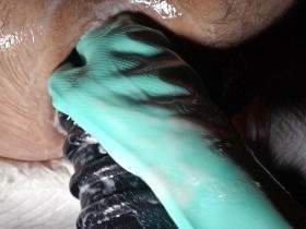 Extremely stretched anal canal with huge grooved dildo and textured glove