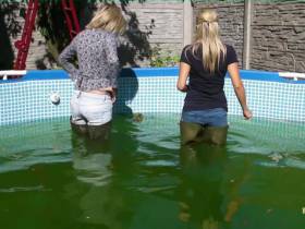 In jeans and waders in pool