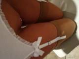 beige nylons and white leather shoes for Suspender