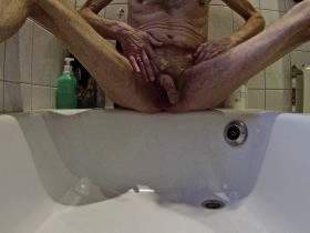 Unshaven cock pisses in shower tray