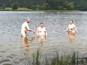 Two women, one man go bathing 3