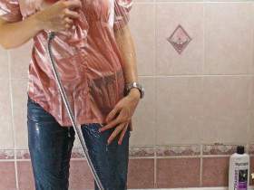 Christina takes a shower in Jeans and Satin Blouse