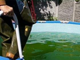 Christina in Waders and Jeans in a Pool