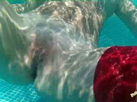 Satin blouse, nylons and mini skirt striptease in the pool - underwater