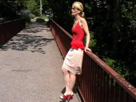 posing in sexy red mules