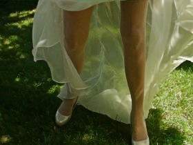 In a wedding dress and lingerie in the garden