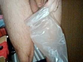 John is Peeing into a Plastic Bag