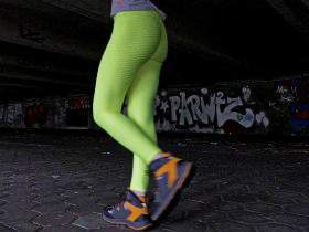 Green leggings in the garage and on the sidewalk