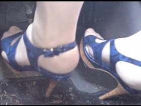 Blue heels on the gas pedal
