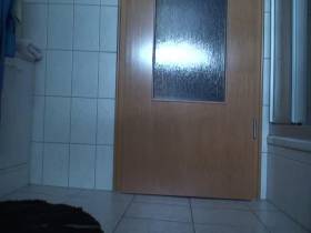 Barefoot shitting in front of the bathroom door