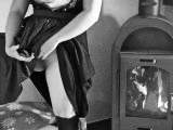 Young Dirndl whore by the fireplace ... shaved & horny