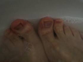 Male feet in water