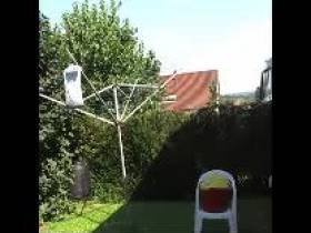 Nude hang laundry in the garden