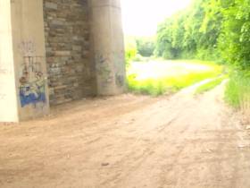 Pissing under motorway bridge