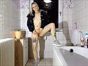 Pissing in jacket and sneakers