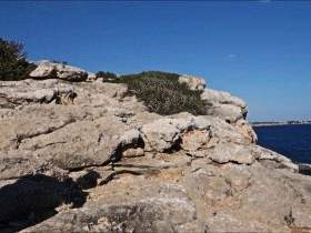 In a micro bikini on the cliffs