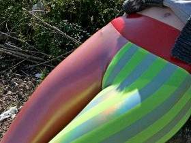 Red and green striped leggings in parking lot