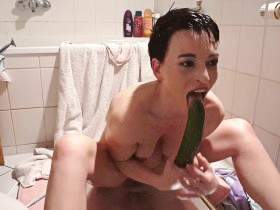 Mmmh ... With a thick cucumber in the bathroom