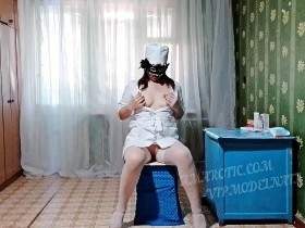 Nurse Olga sits on a chair