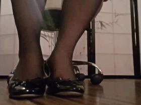 Foot erotic with patent balsa flats and white and black nylons