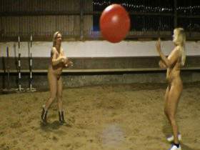 Naked with a giant balloon in the riding hall