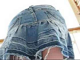 Secretly filmed naked under skirt