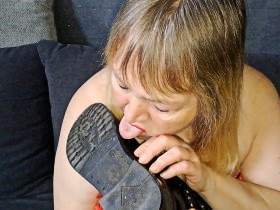 submissively lick the boots clean