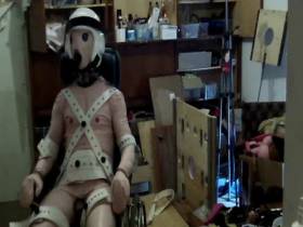 the rubber doll is turned off, strapped and twitches under current