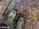 With the rubber boots in the mud