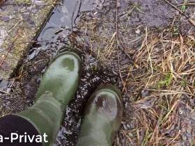 With the rubber boots in the mud