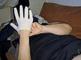 Masturbation with a latex glove