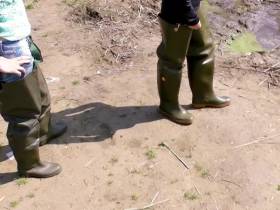 Christina and Jackie walking with Waders in a river