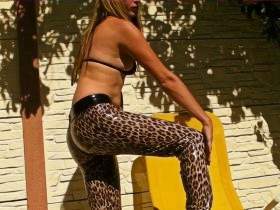Nikki posing outdoors in Vinyl Leopard Leggins