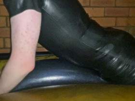 Humping inflated waterbed tube on waterbed in latex