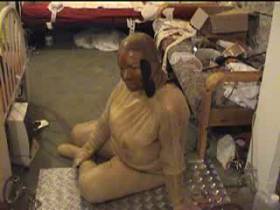 slave in rubber pissed