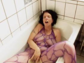 In Catsuit in the bathtub